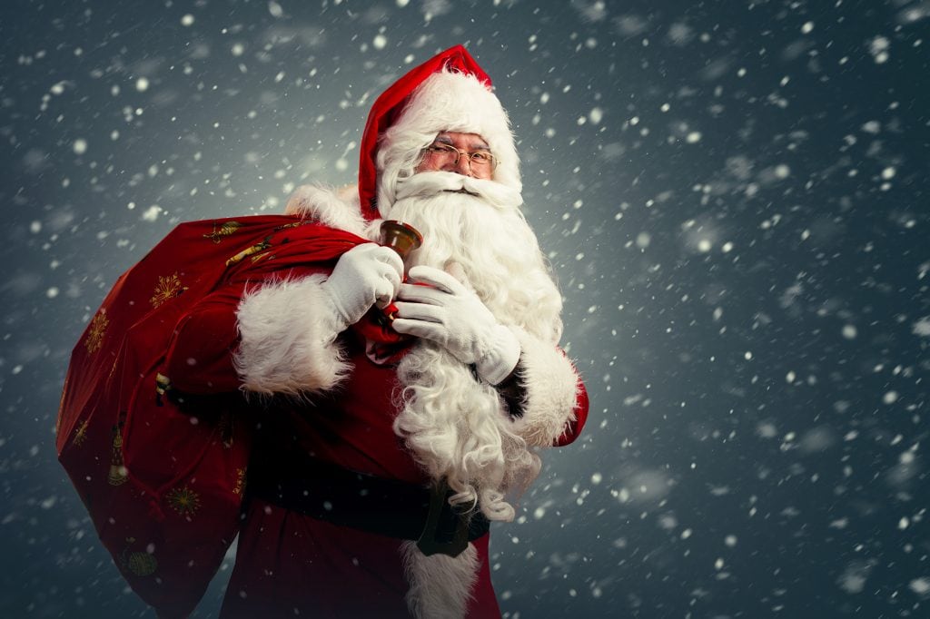 Santa Claus holding a bag with presents